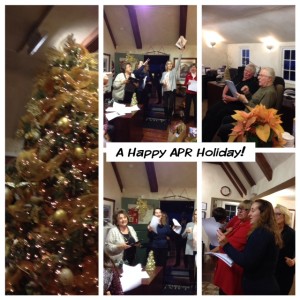 Alain Pinel agents celebrating singing holiday songs.