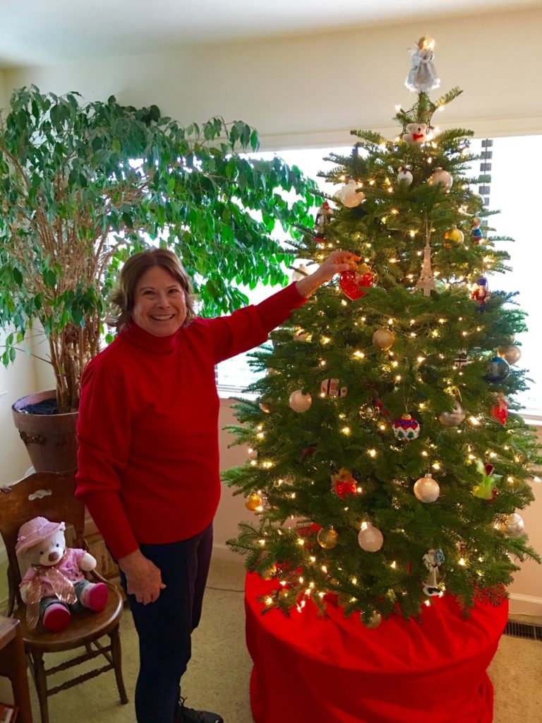 Susan trimming tree - the truth is she did the "heavy lifting" on the trimming.