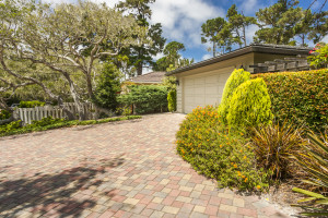 Two-car garage with a paver stone driveway 