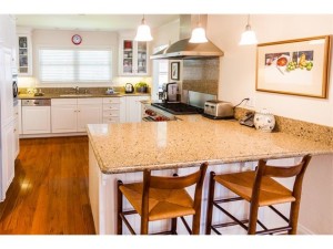 Kitchen with Cambria Quartz counters, maple cabinets, and dual fuel Wolf range.