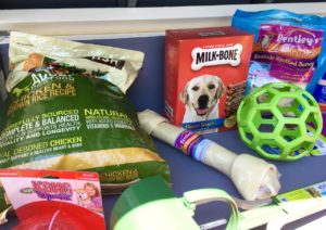 Doggie treats and playthings in the lid.